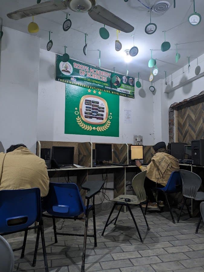 Roots Academy computer lab — students working at computers